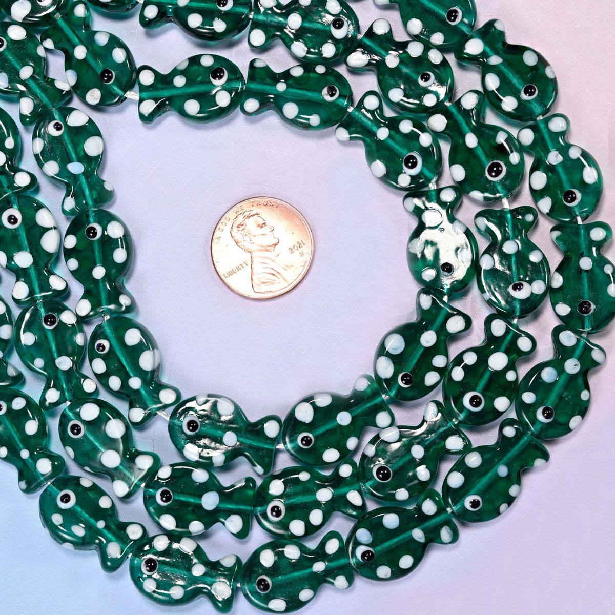 Transparent Jungle Green with White Dot Fish Glass Beads, deep bottle-green glass you can see straight through