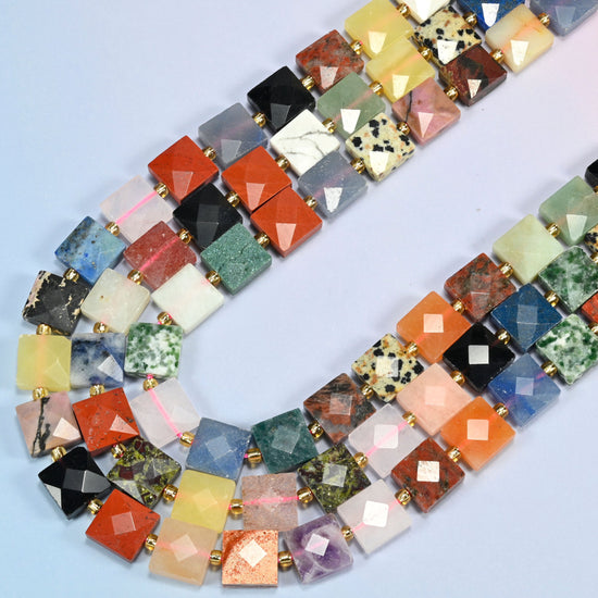 Assorted gemstone faceted flat square beads in several strands curved into a wide U, colorful mixed stones