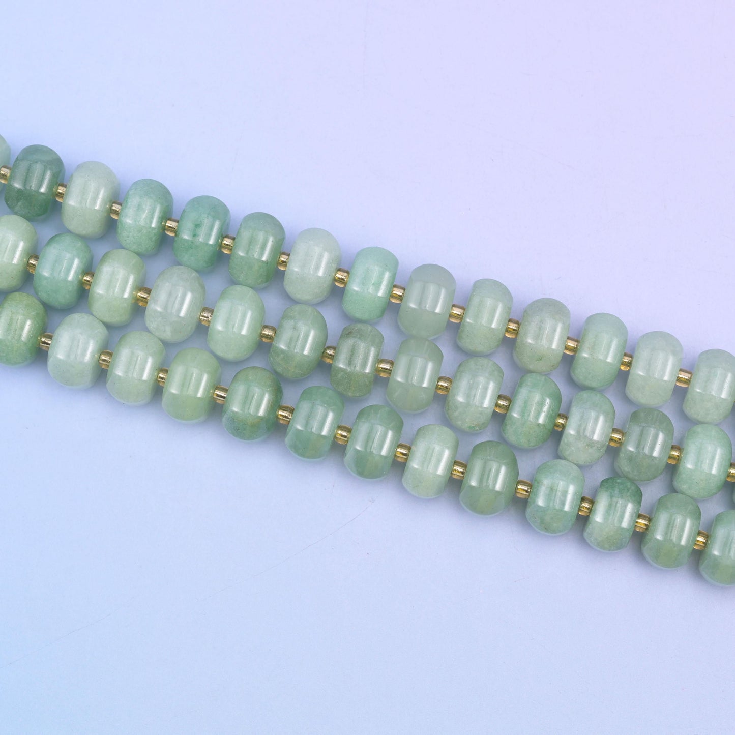 Green aventurine beads in soft mint-to-forest green with gentle sparkle