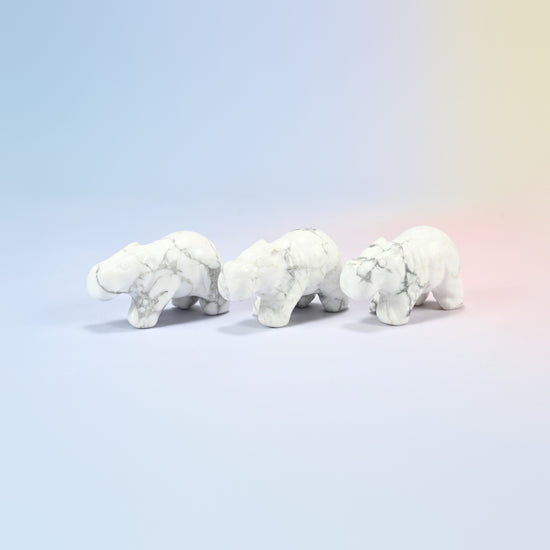 Three natural white howlite hippo crystal carvings, 2 inch, white with gray veining