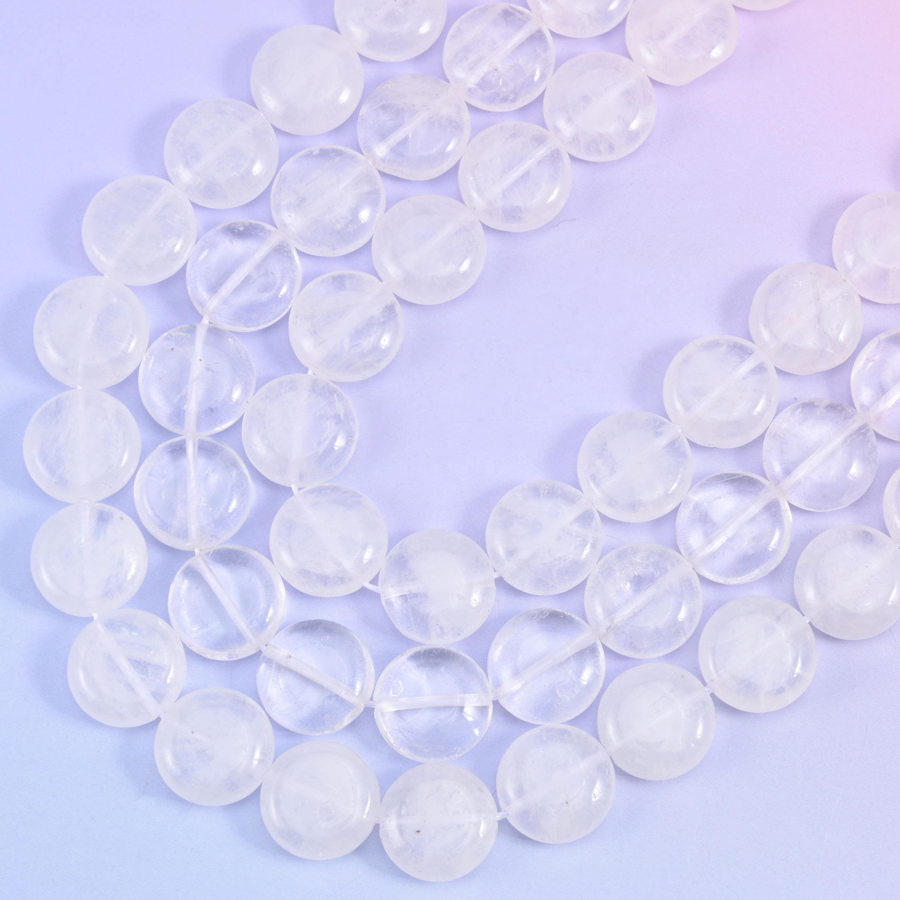 Close curve of the strand showing snowy white veils trapped inside the translucent quartz coins