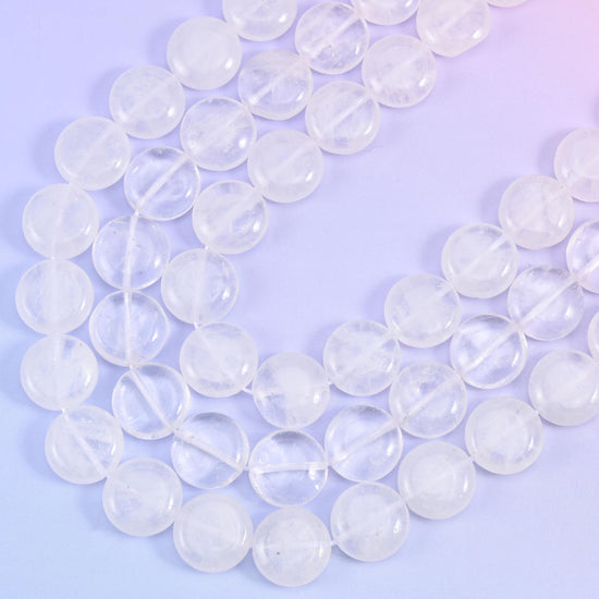 Close curve of the strand showing snowy white veils trapped inside the translucent quartz coins