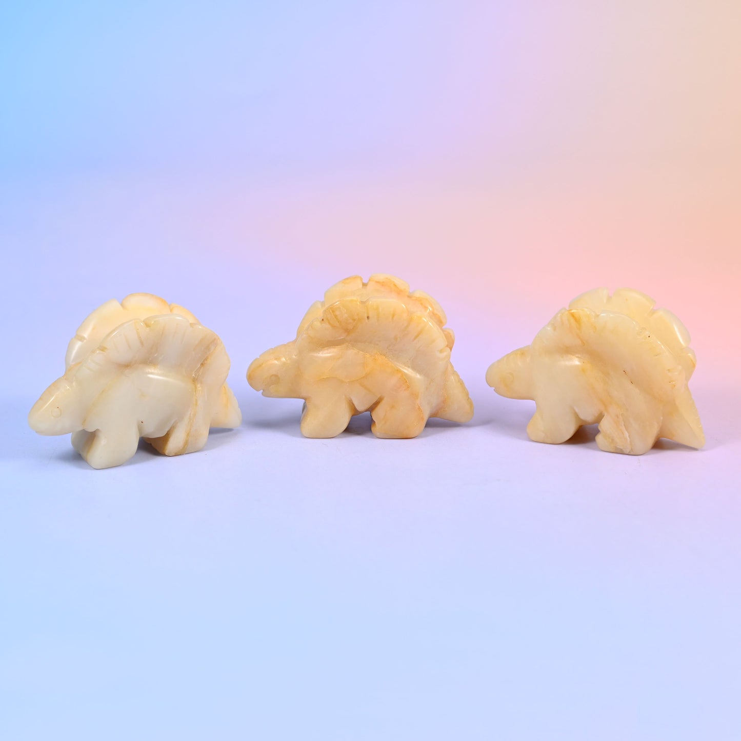 Carved stone stegosaurus figurine, polished to a high shine, about 1.4 oz, sold per piece