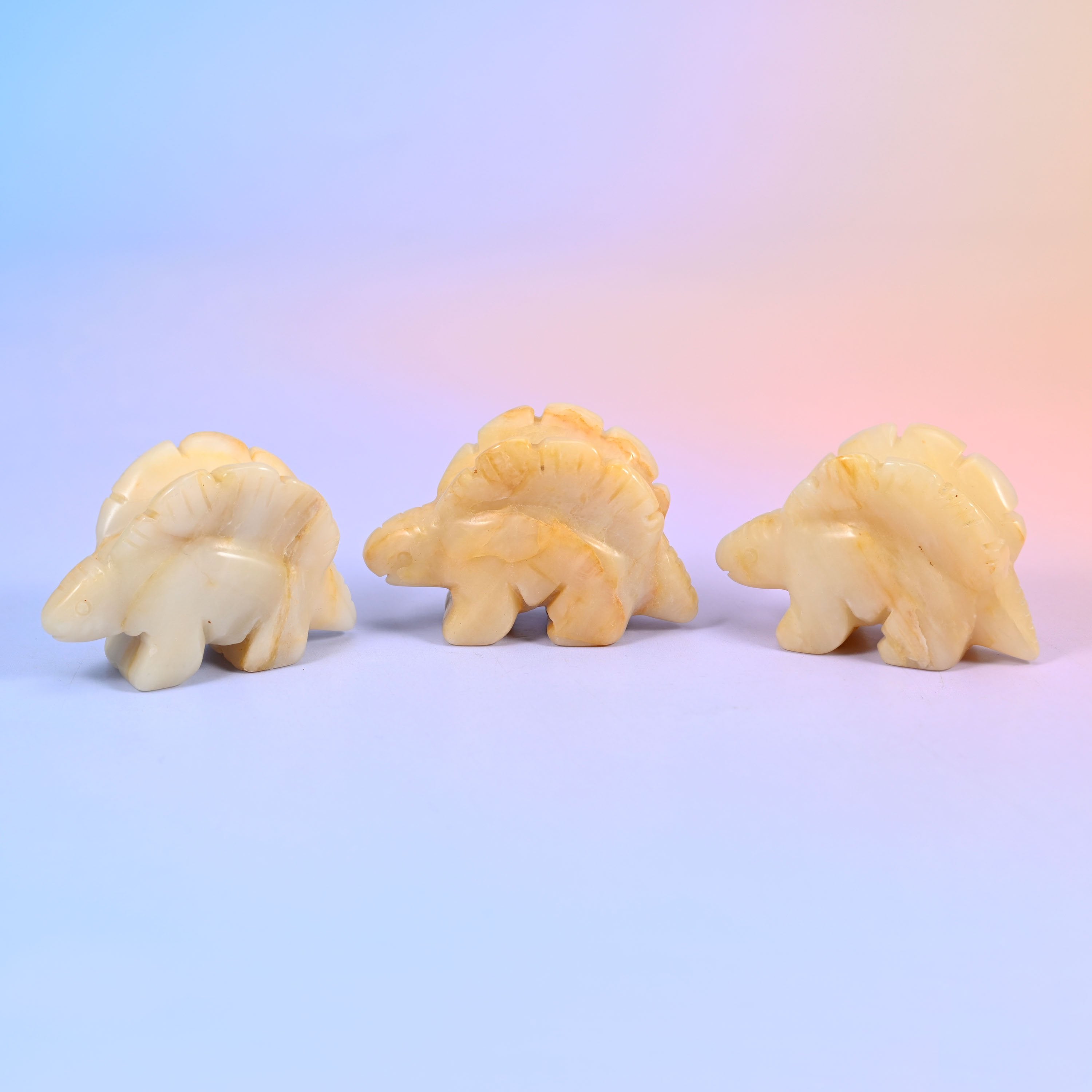 Carved stone stegosaurus figurine, polished to a high shine, about 1.4 oz, sold per piece