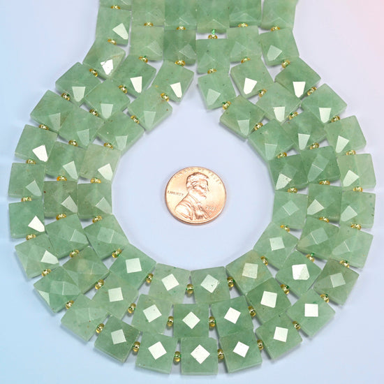 Natural green aventurine faceted flat square strands formed into a teardrop loop around a US penny for scale