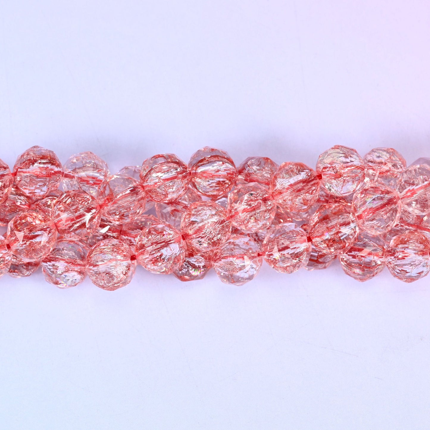 Transparent red faceted round glass beads, approximately 42 beads per strand