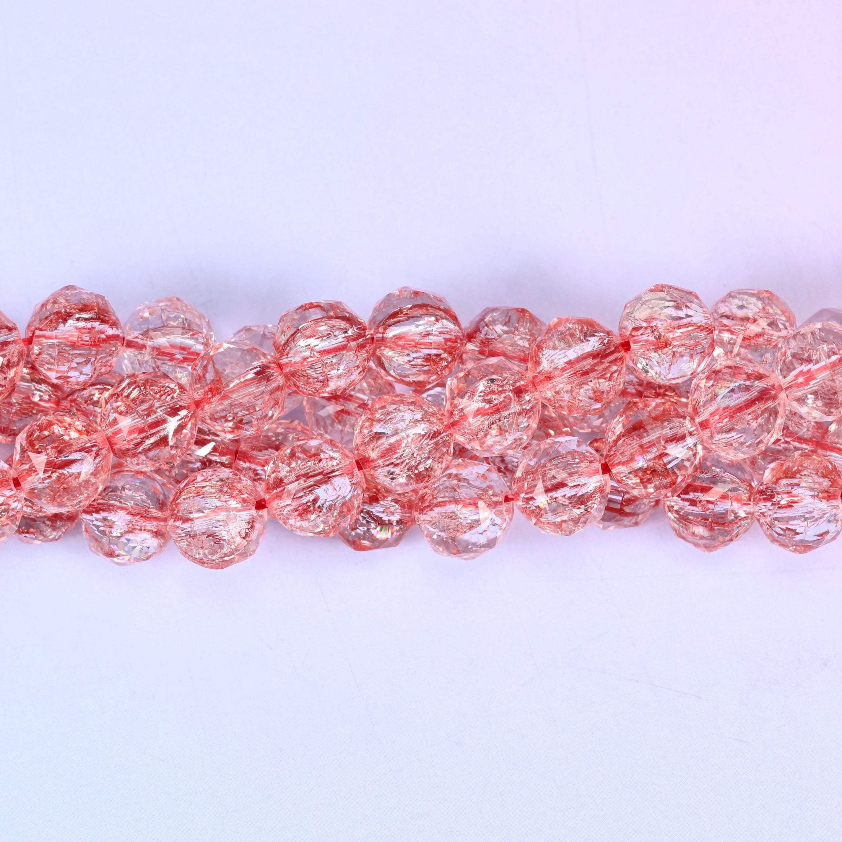 Transparent red faceted round glass beads, approximately 42 beads per strand