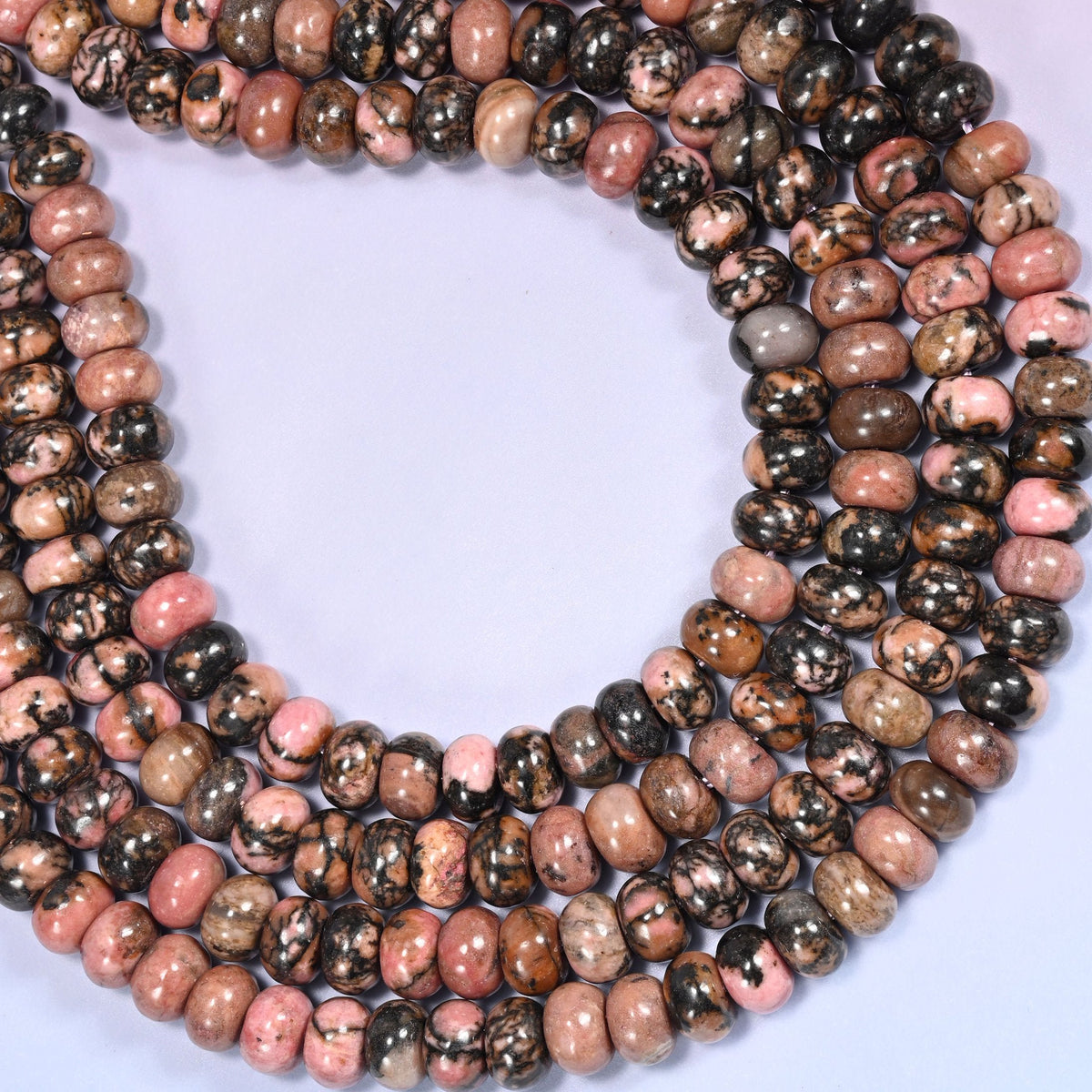 Natural Rhodonite Rondelle Beads with a large 2.5mm centrally drilled hole.