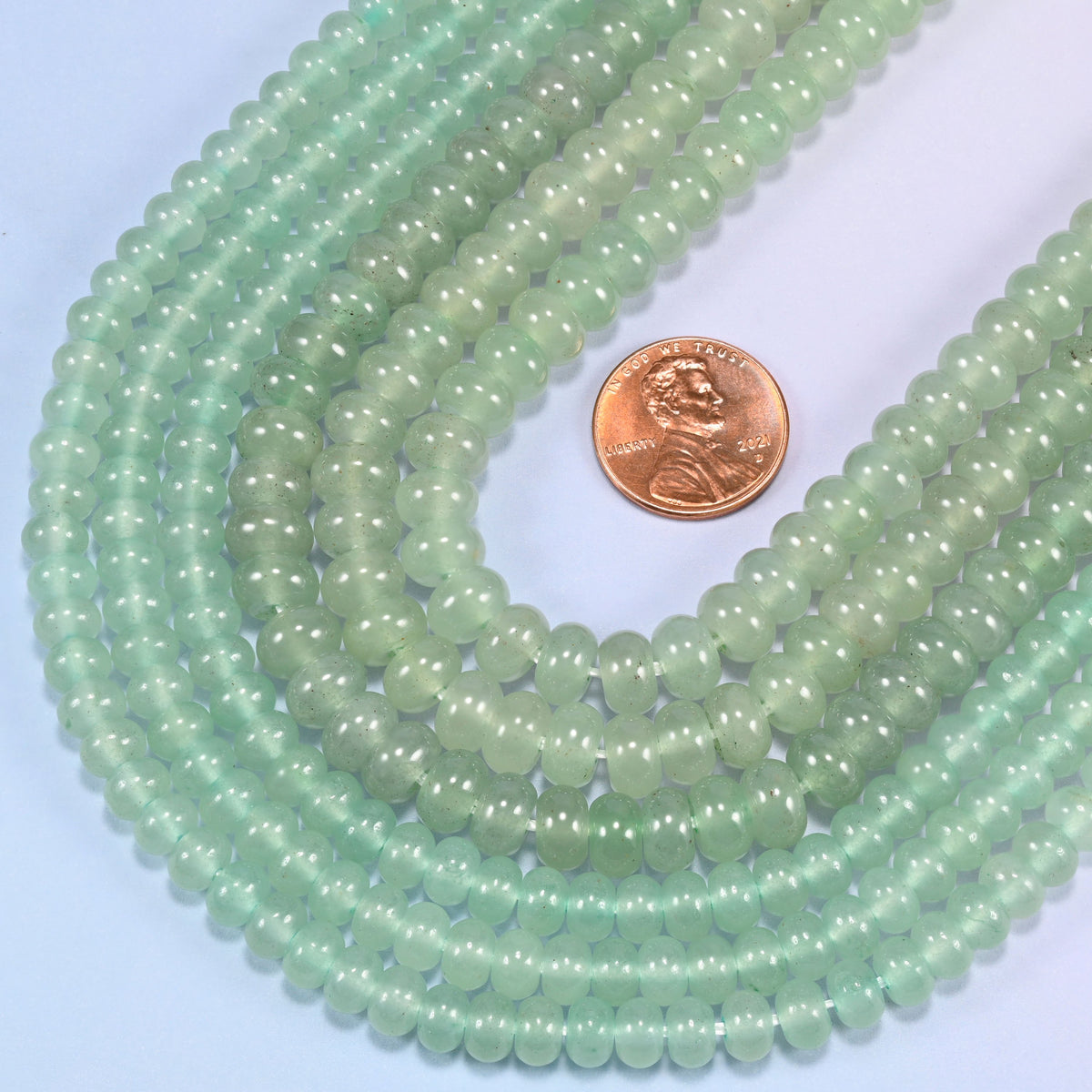Green Aventurine gemstone rondelle beads in a wide U, each bead centre drilled with a 1.0mm to 1.2mm hole