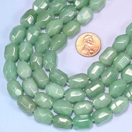 Wide circular coil of green faceted Aventurine barrel bead strands forming a full wreath shape on a light lavender background.