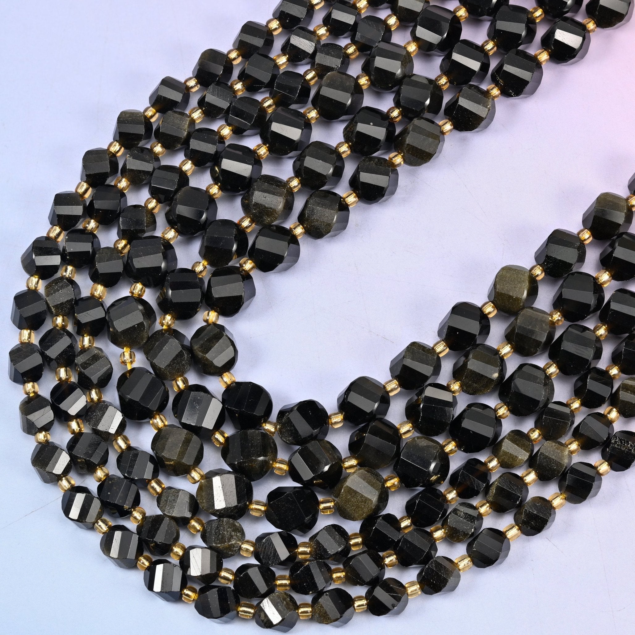 Gold Obsidian faceted spiral twist beads, 15 inch strand