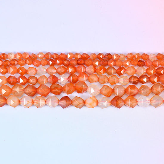 Orange Agate faceted beads in flat horizontal rows, orange shading to near-clear white, sold per 15.5 inch strand