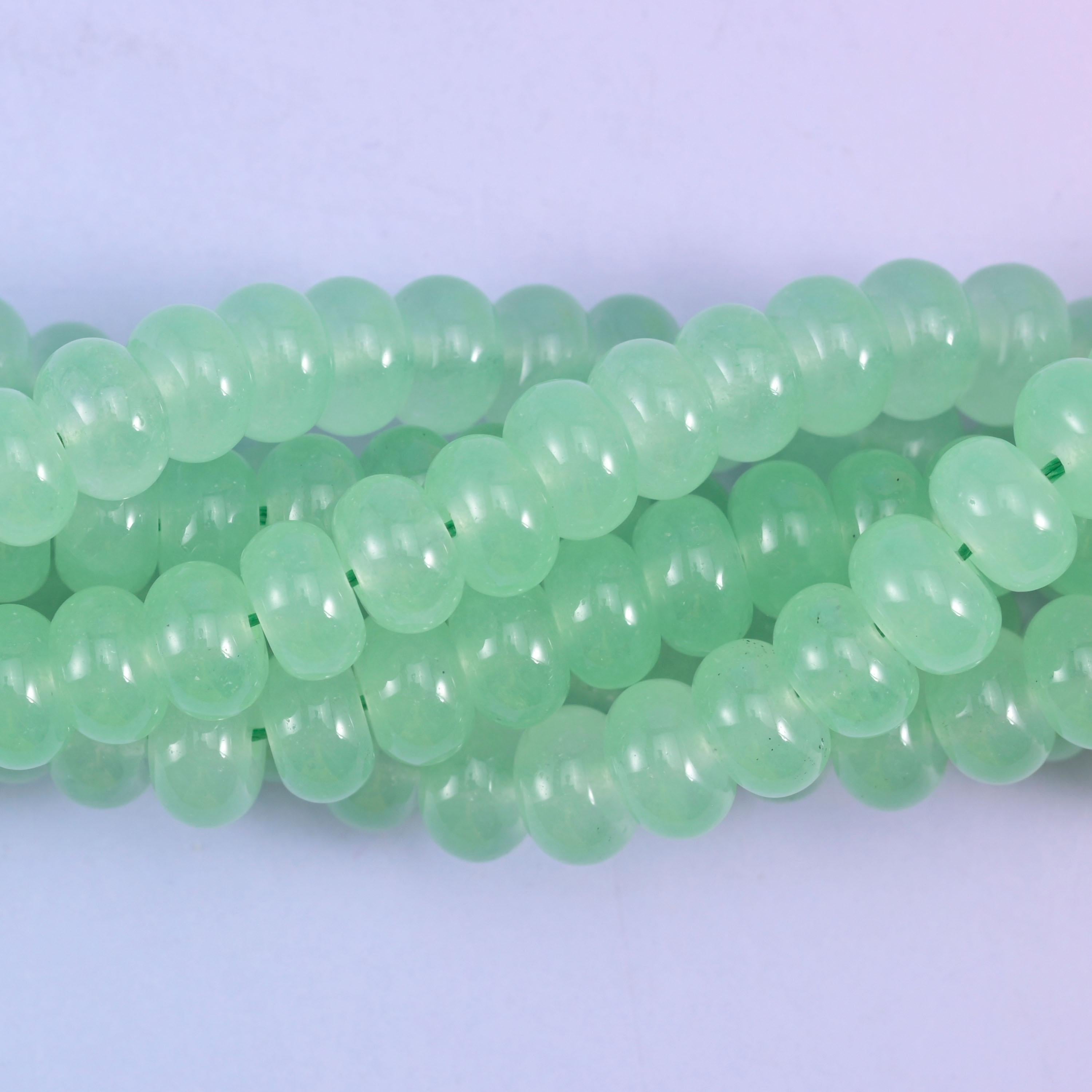 Smooth rondelle cut dyed jade beads with an even glossy polish