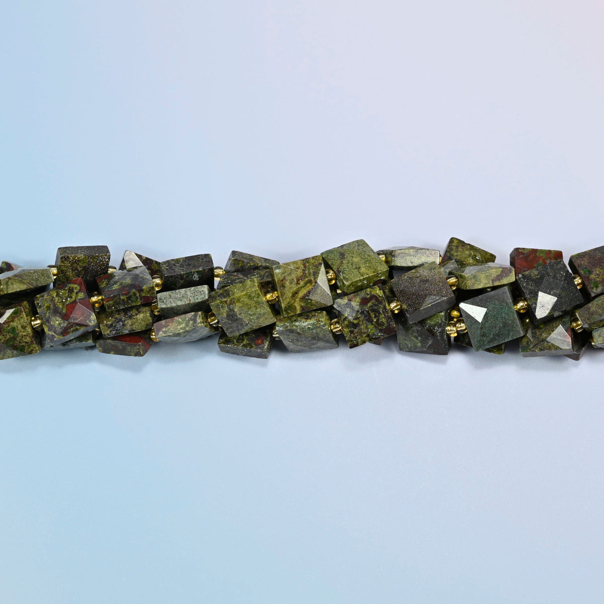 Strands of natural dragon blood stone faceted flat square beads twisted together in a horizontal row