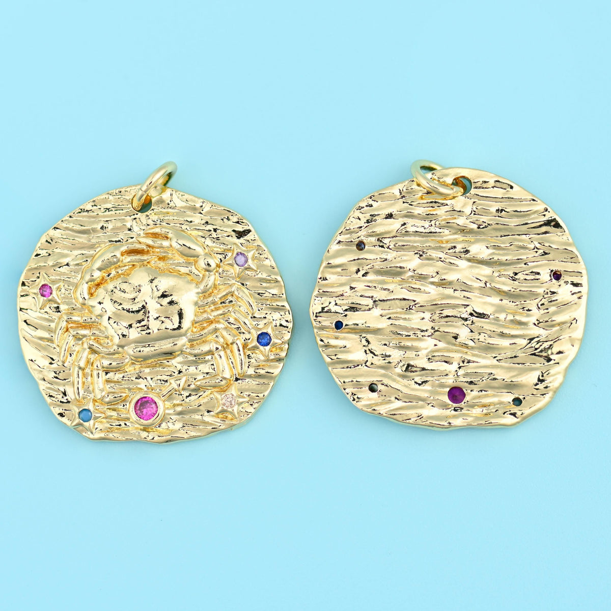 18K gold plated zodiac pendant with a crab motif, front and back, coloured zirconia set into the hammered gold