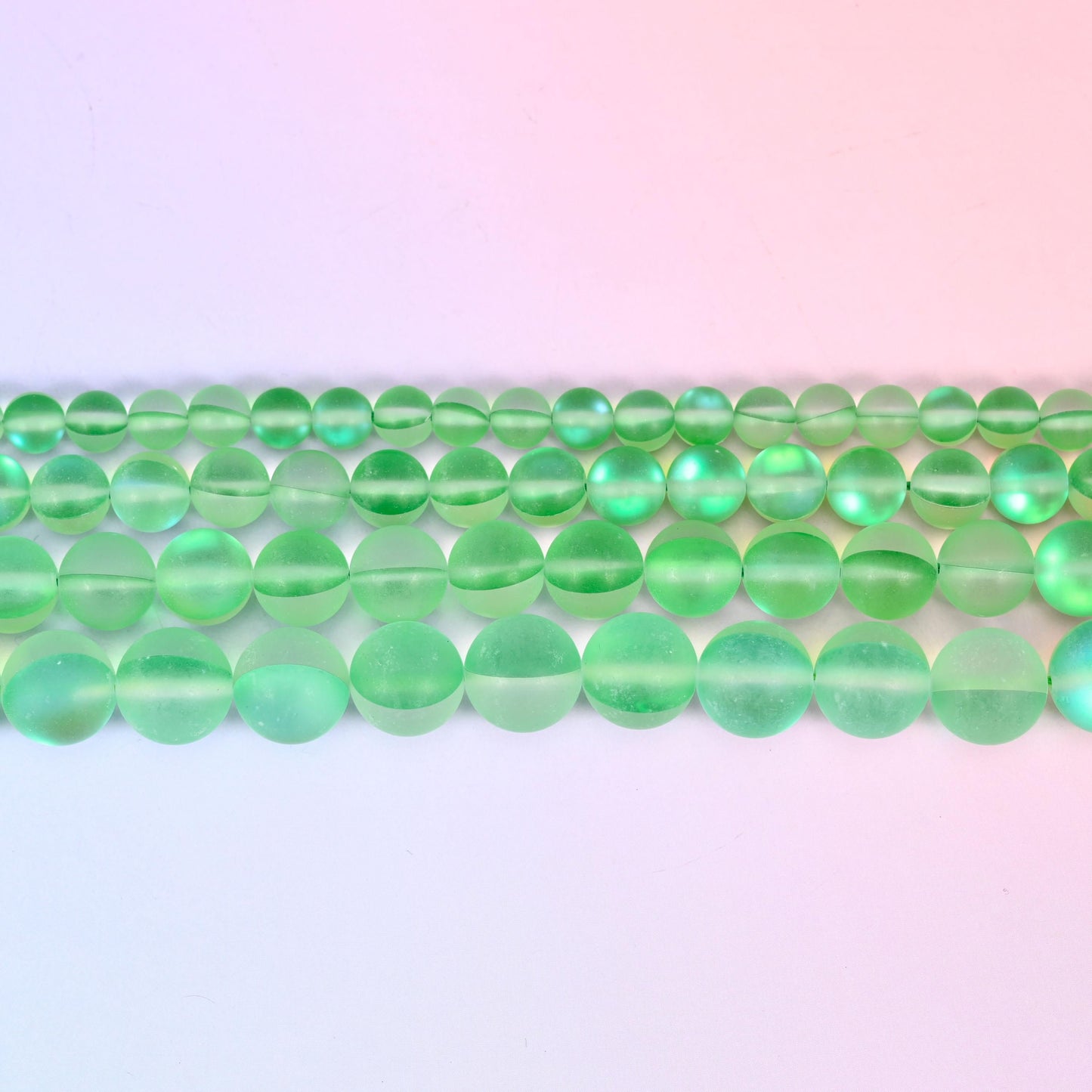 Matte glass beads in fresh apple green with a cool blue-green flash