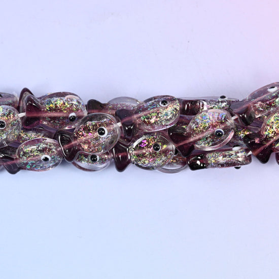 Iridescent purple fish glass beads, approximately 20 pieces per strand