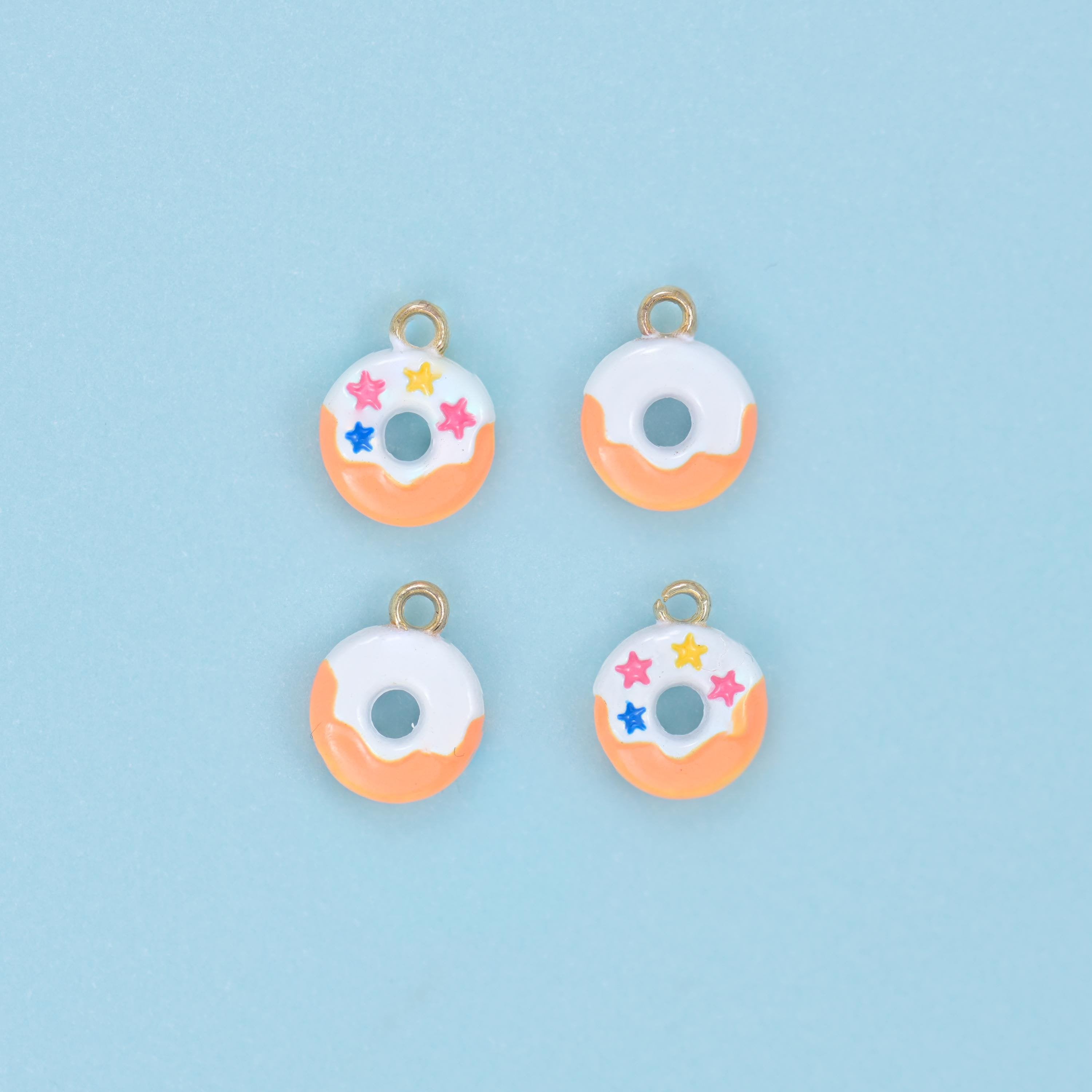 Enamel Star Sprinkle Donut Charm 10x8mm in peach icing with star sprinkles