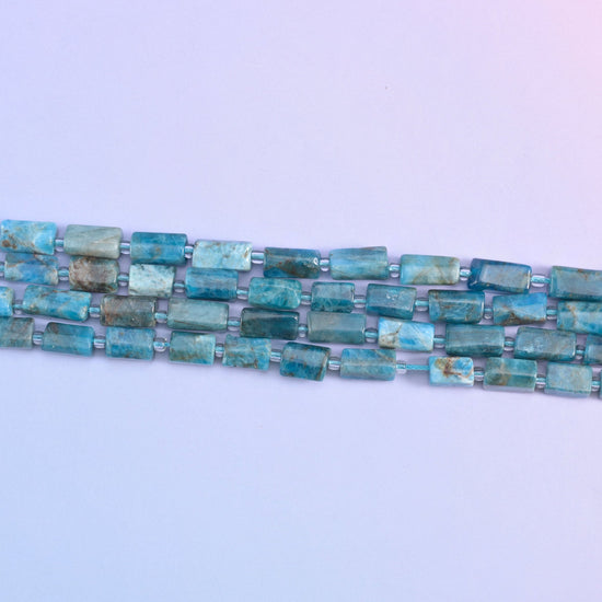 Blue apatite beads in natural color variation