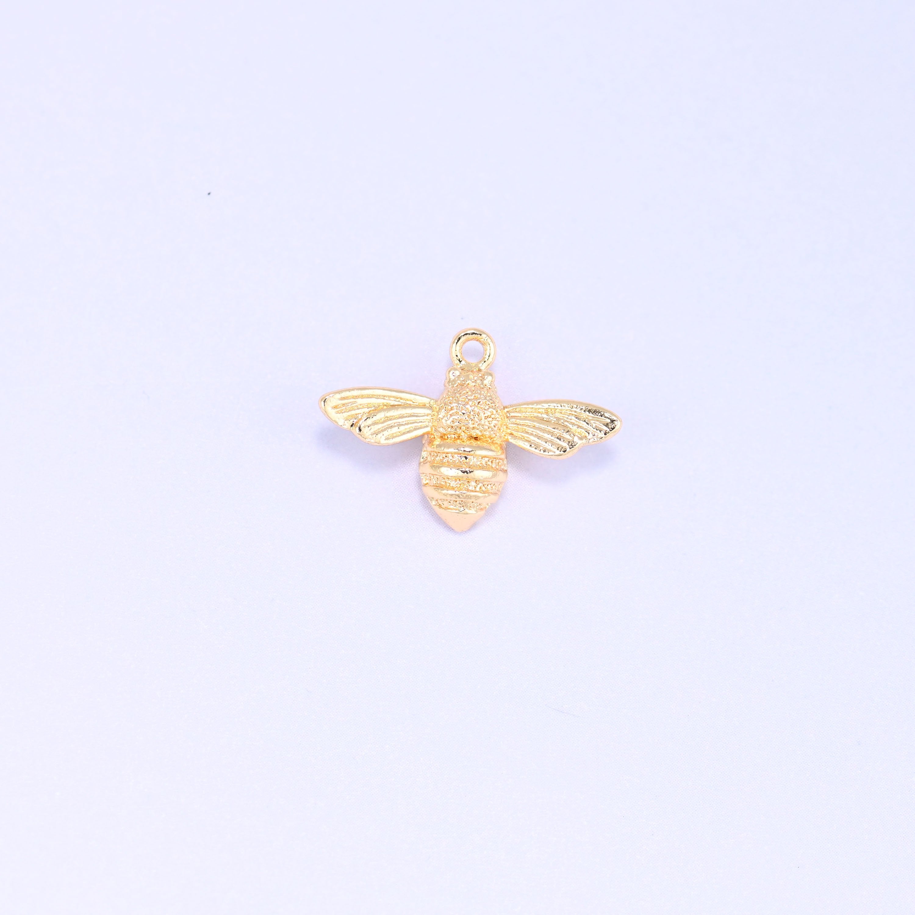 Small gold charms bee, single 18K gold plated brass charm shown front on with wings spread