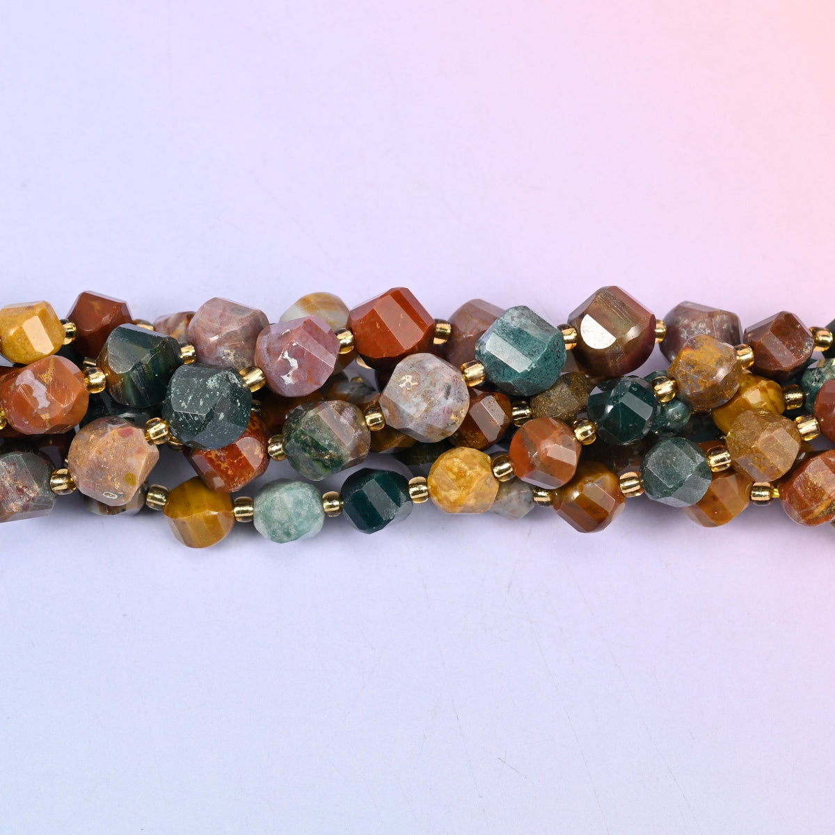 Ocean Agate Faceted Spiral Twist Beads, mustard yellow, sea green, rust red, cream and smoky grey running together