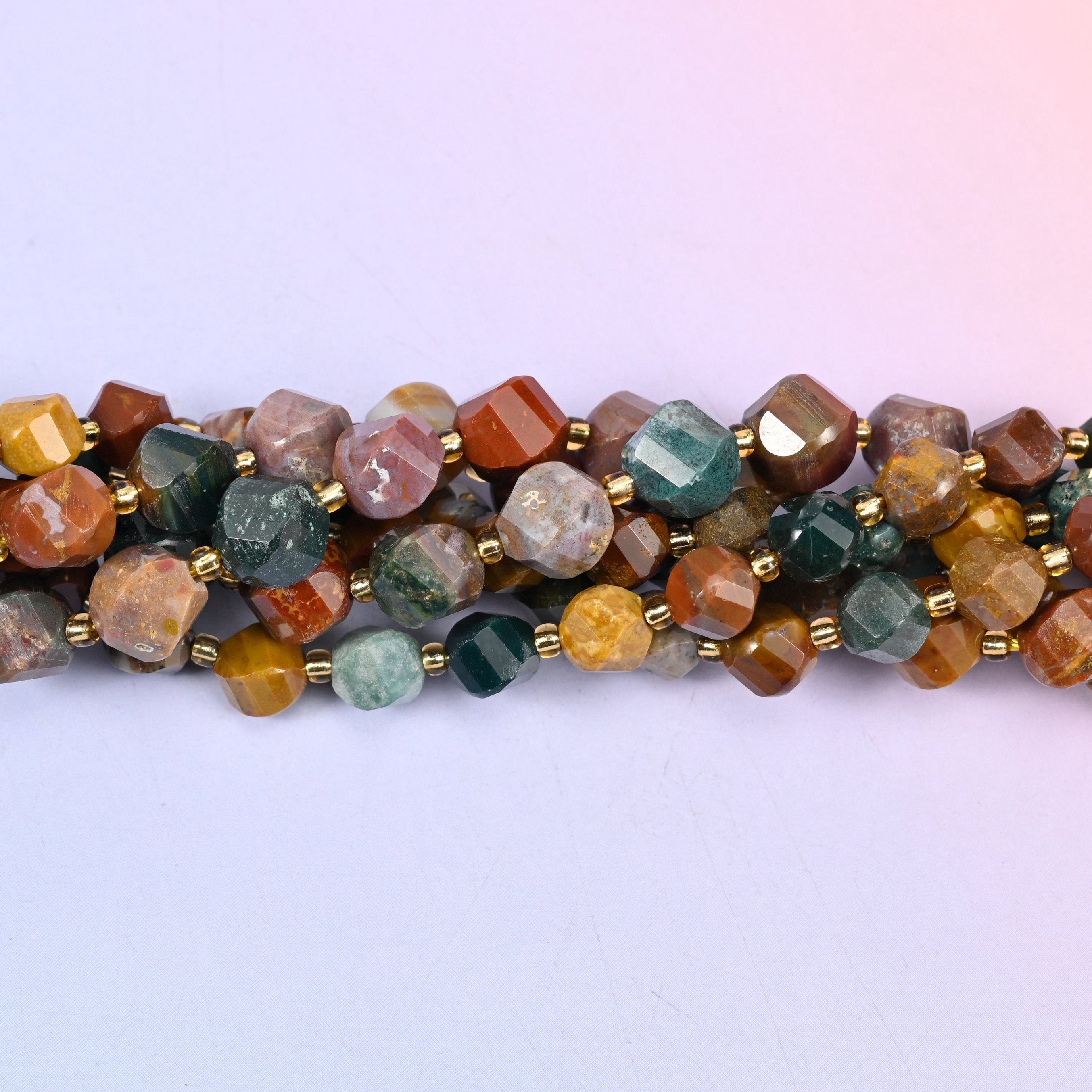 Ocean Agate Faceted Spiral Twist Beads, mustard yellow, sea green, rust red, cream and smoky grey running together