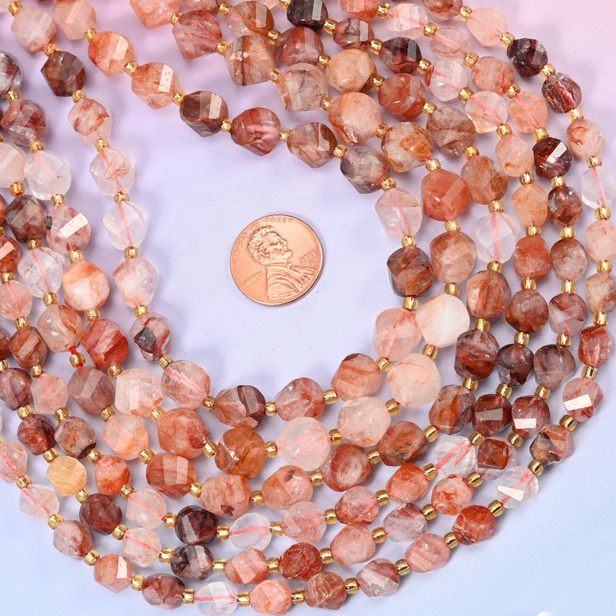 Natural iron inclusions ranging from pale milky beads to deep brick red