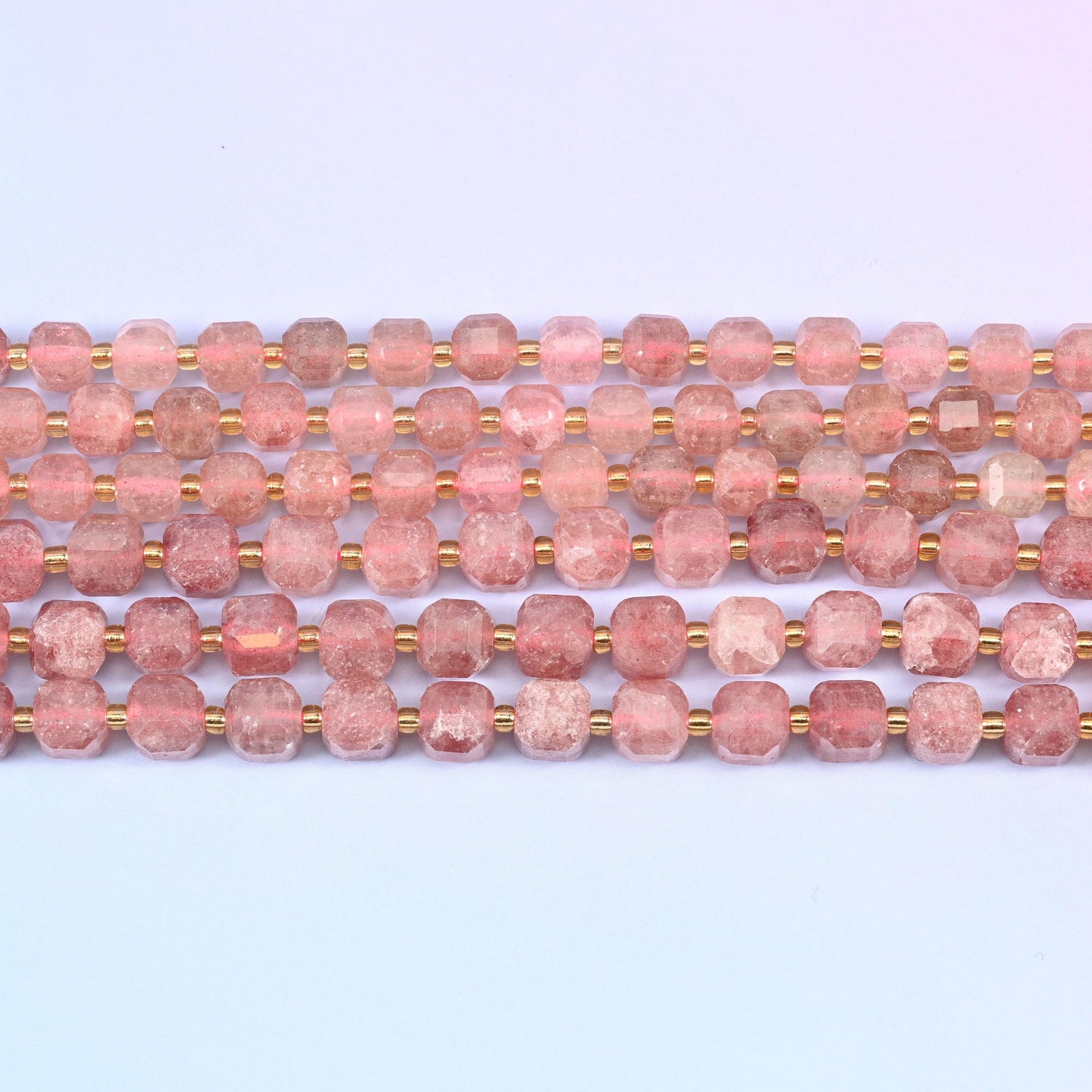 Strawberry Quartz in dusty rose with rust-red mineral flecks