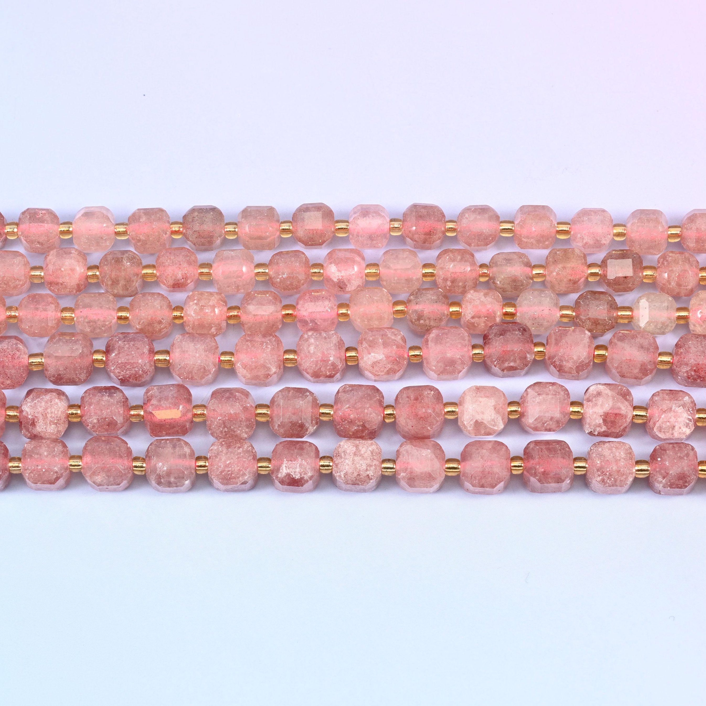 Strawberry Quartz in dusty rose with rust-red mineral flecks