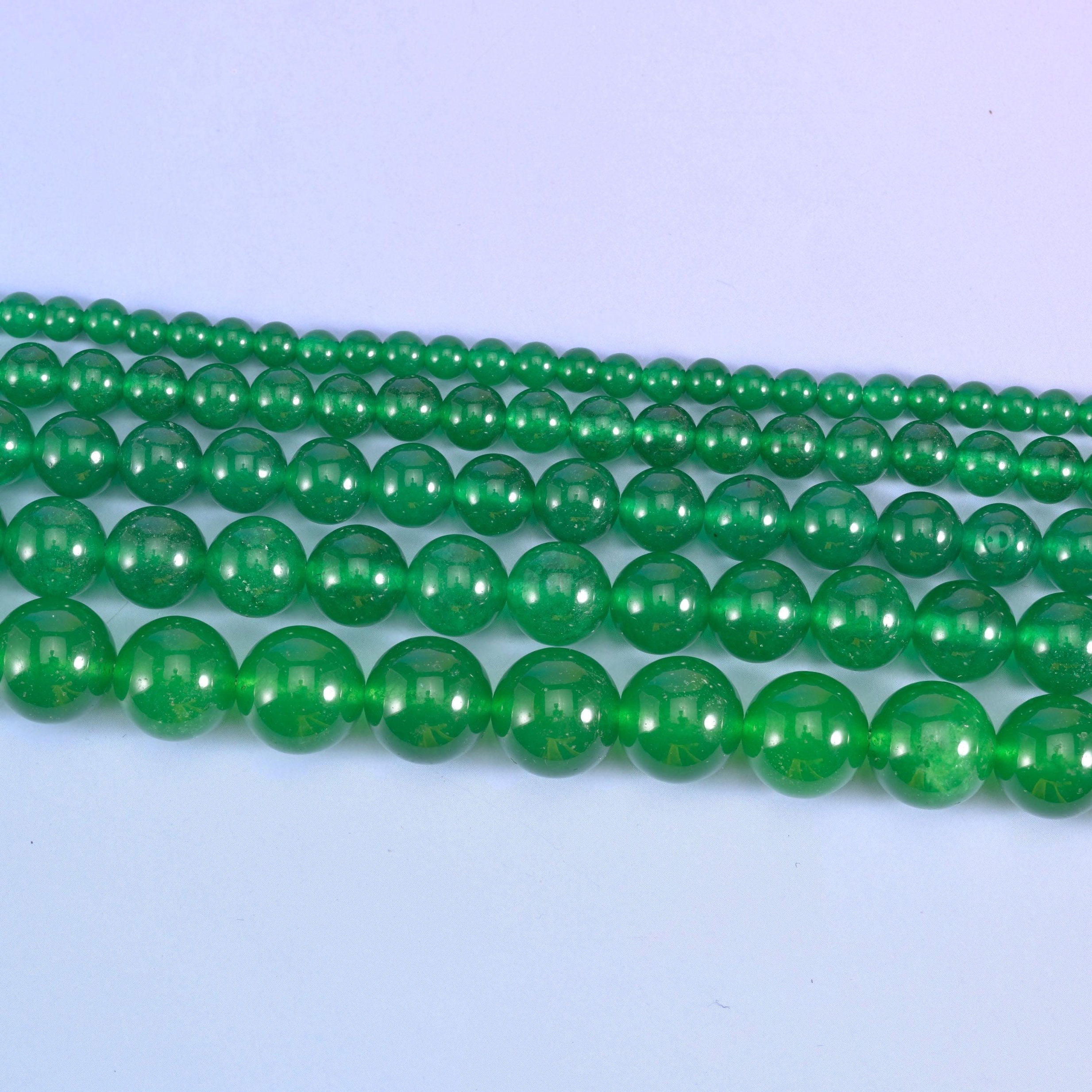 Dyed jade round beads in emerald green