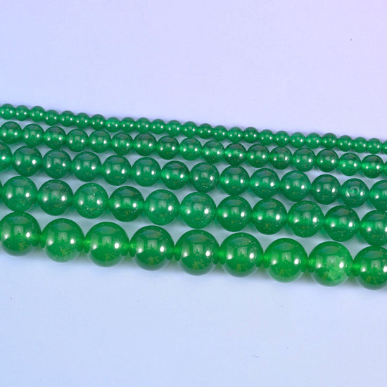 Dyed jade round beads in emerald green