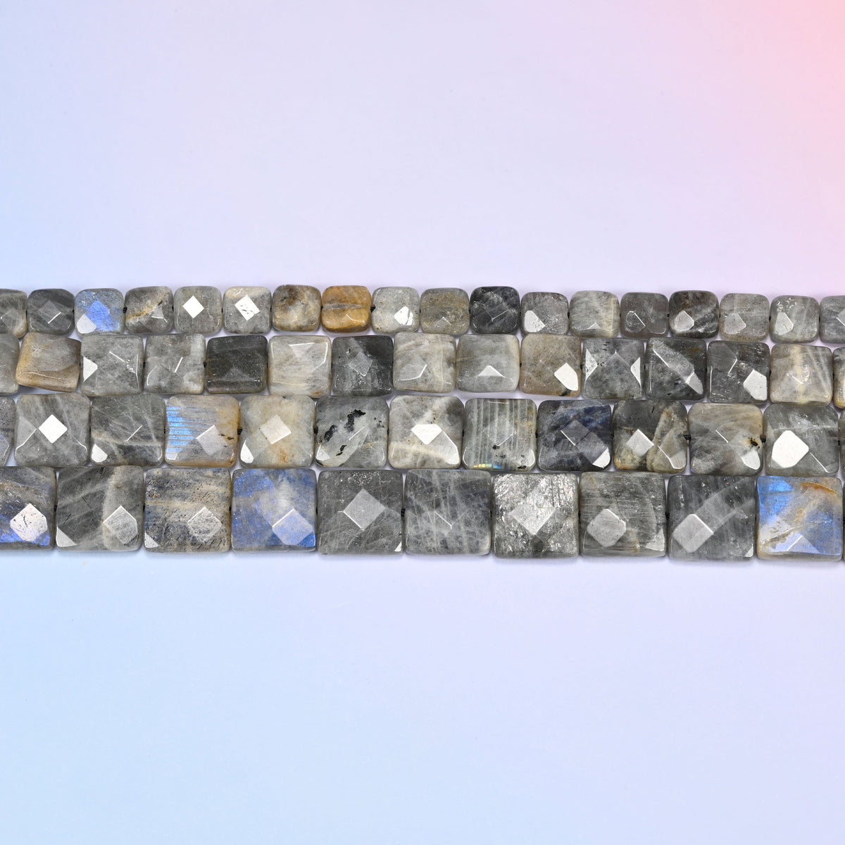 Gray Labradorite faceted flat square beads in horizontal rows, the flat square faces sitting edge to edge