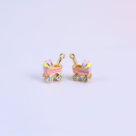 Two pink stroller charms with light purple and yellow striped hoods and light blue flower-spoke wheels.