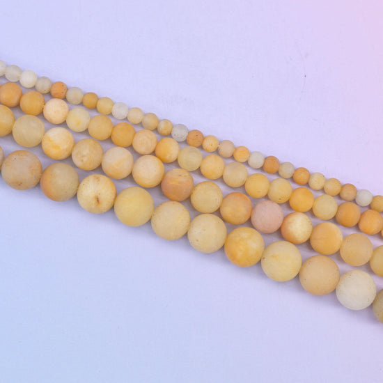 Yellow Jade Matte Round Beads in soft butter and honey yellow with cream and pale apricot