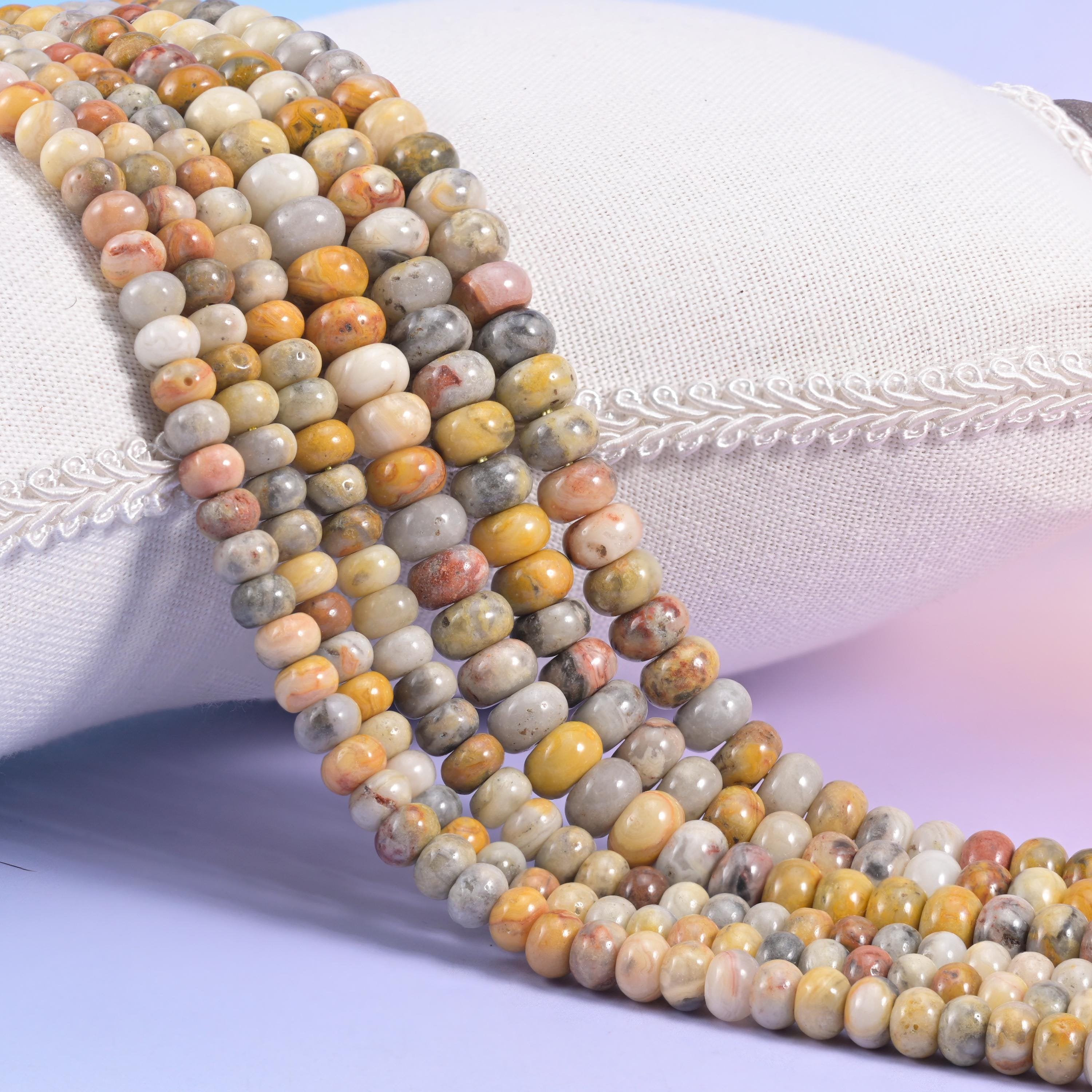 Natural Crazy Lace Agate smooth rondelle beads in a lively mix of amber, cream, gray, and rust tones
