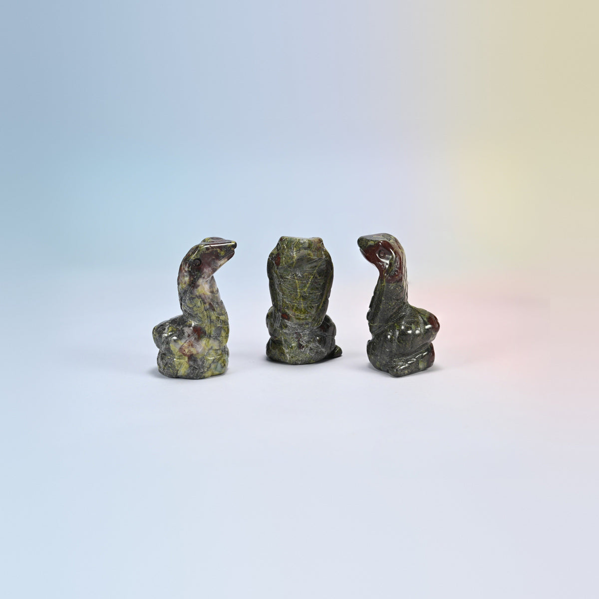 Cobra snake crystal carving in dragon bloodstone, dark green natural stone with red patches
