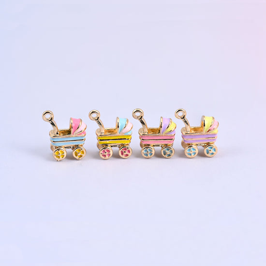 All four stroller charms in a row: light blue, yellow, pink and light purple enamel bodies.