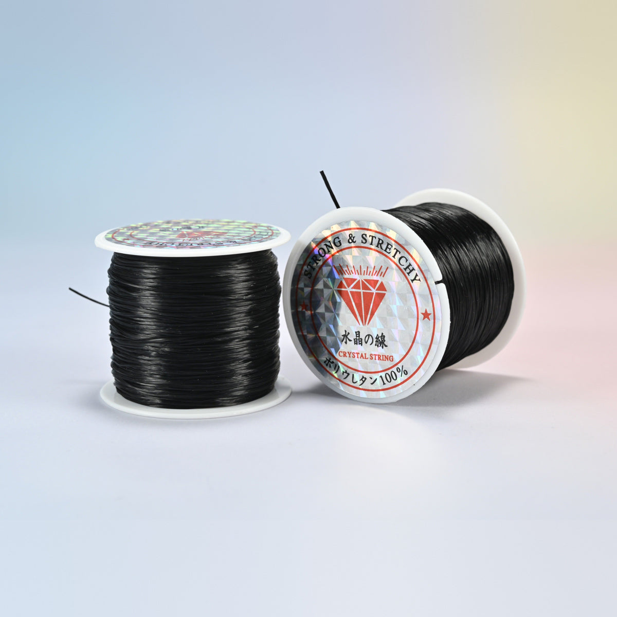 Two rolls of black 0.7-0.8mm elastic stretch string, glossy polyurethane bead cord with a holographic label