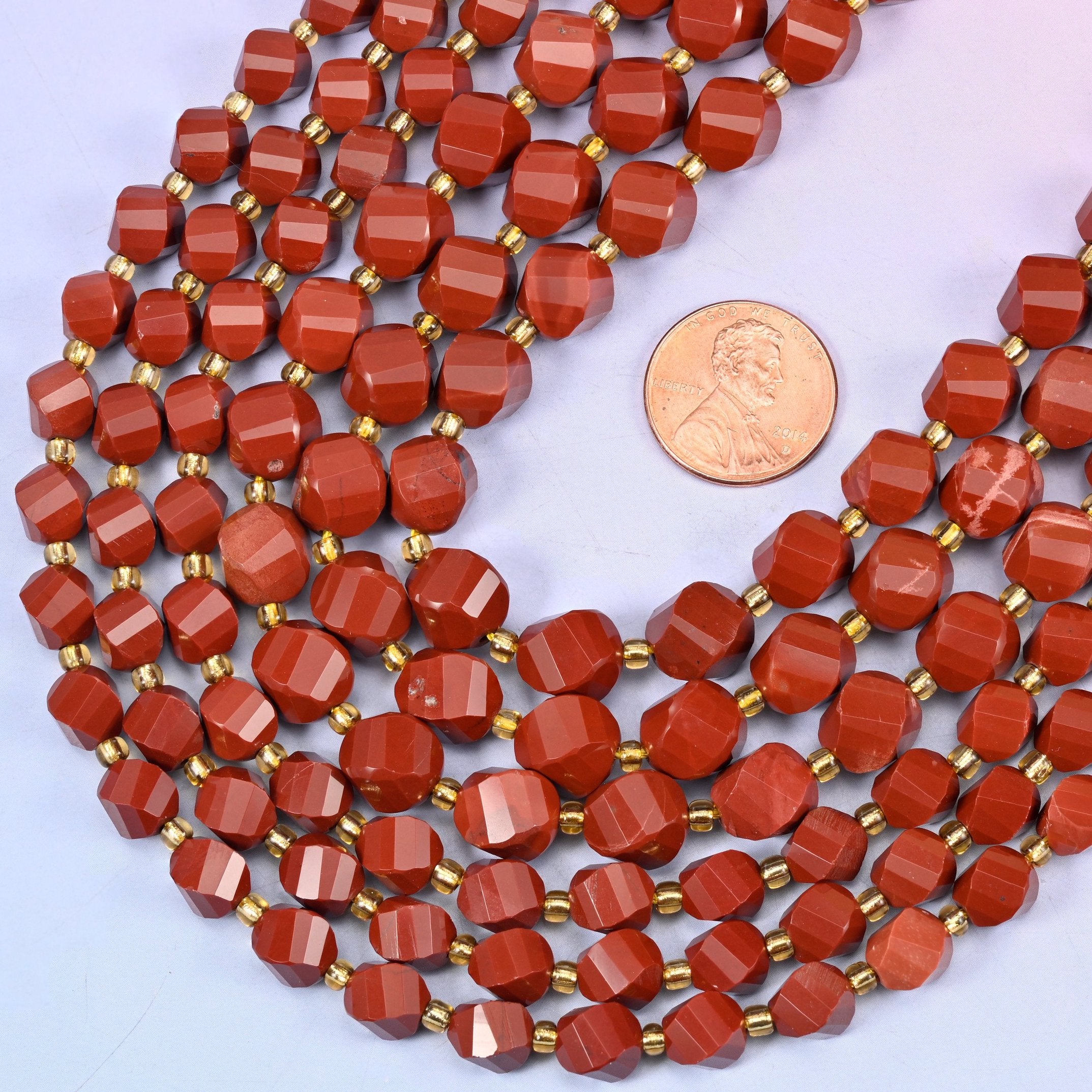 Faceted spiral twist cut natural red jasper beads for jewelry making.