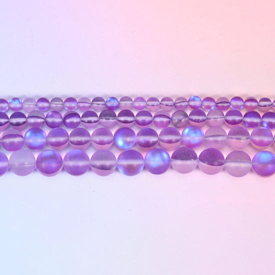 Matte glass beads in soft violet and lilac with a cool blue-lilac flash
