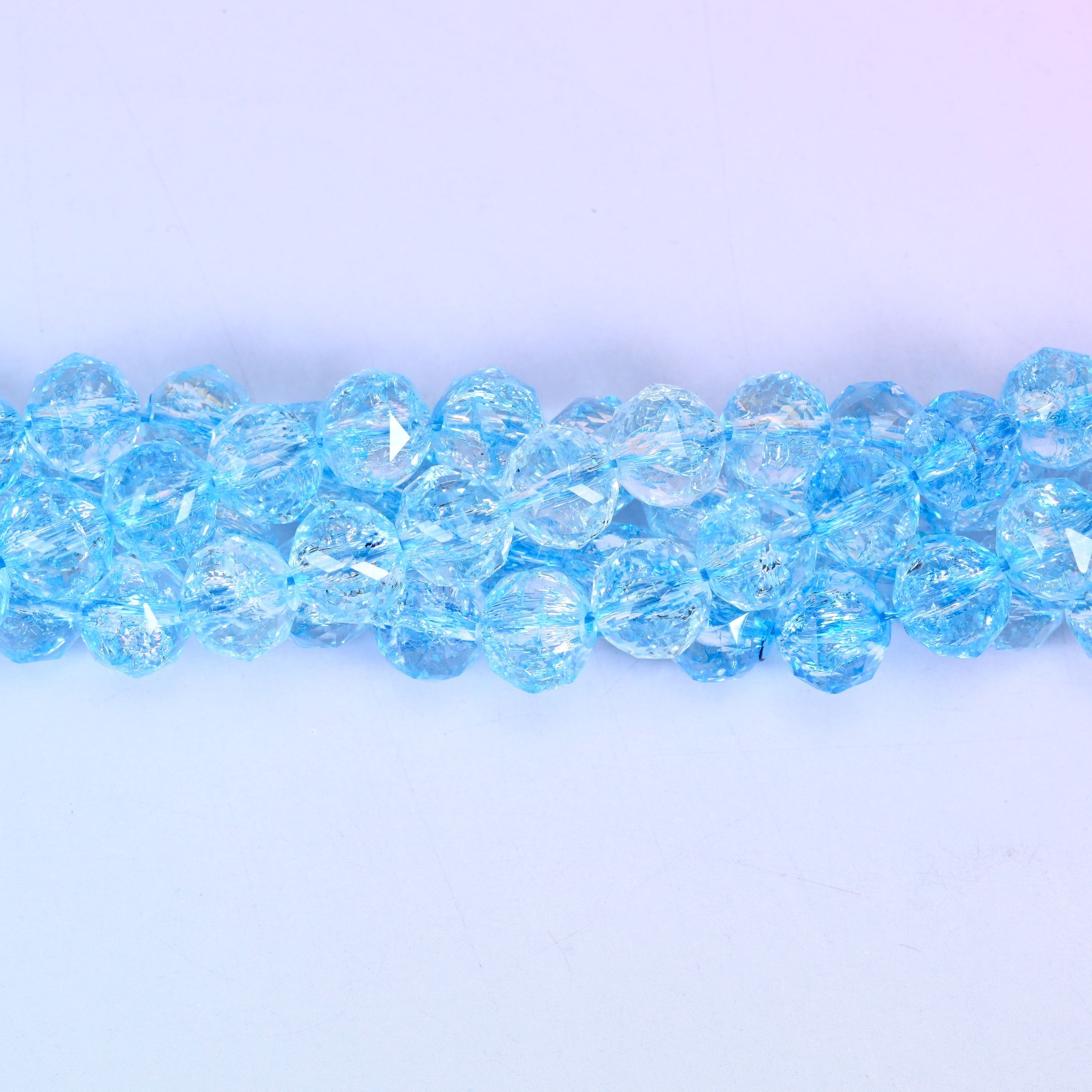 Transparent blue faceted round glass beads, approximately 42 beads per strand