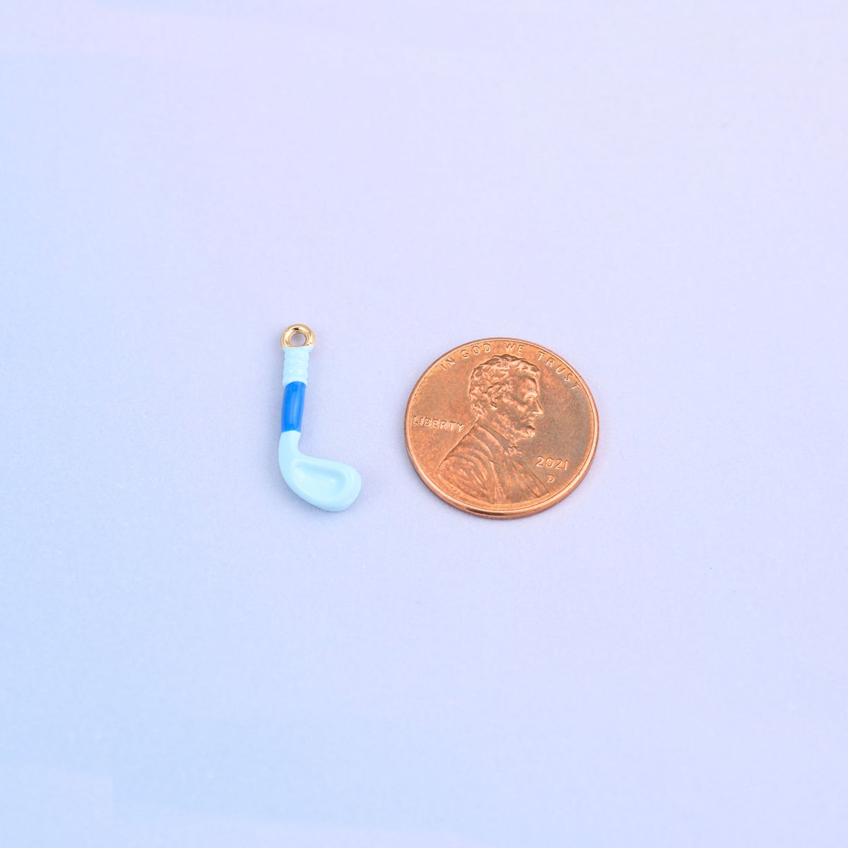 Light blue golf club charm shown at actual size, 20 x 8mm.