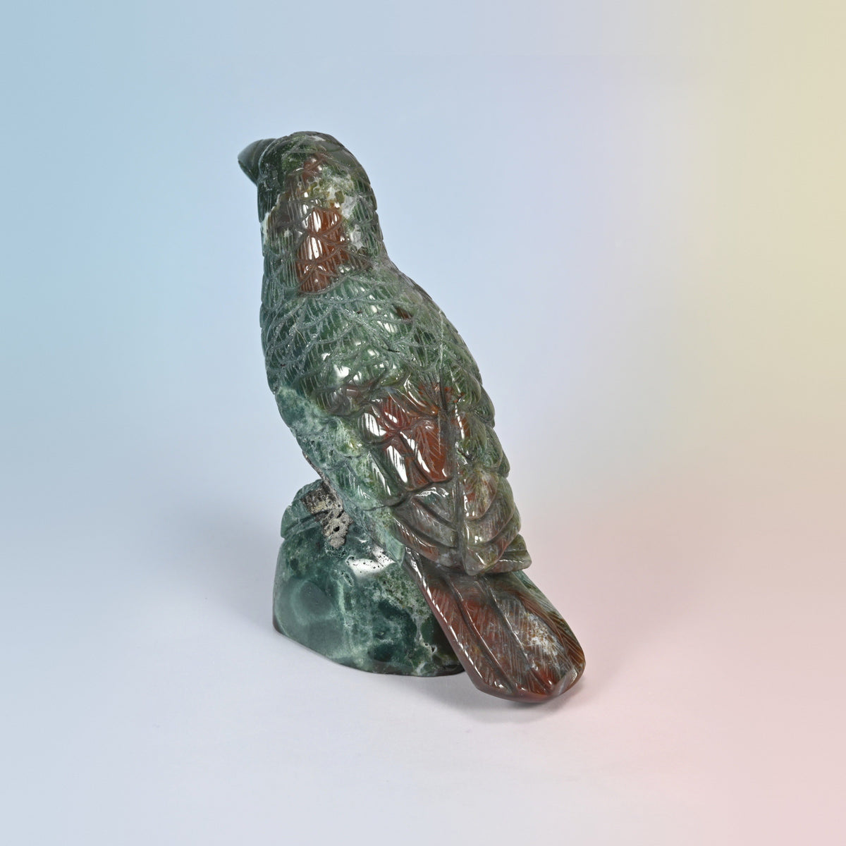 Indian agate crow carving from behind on the left, green and red agate patterning