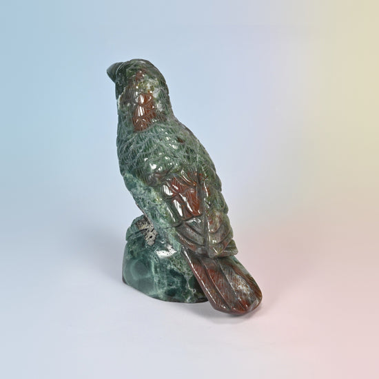 Indian agate crow carving from behind on the left, green and red agate patterning