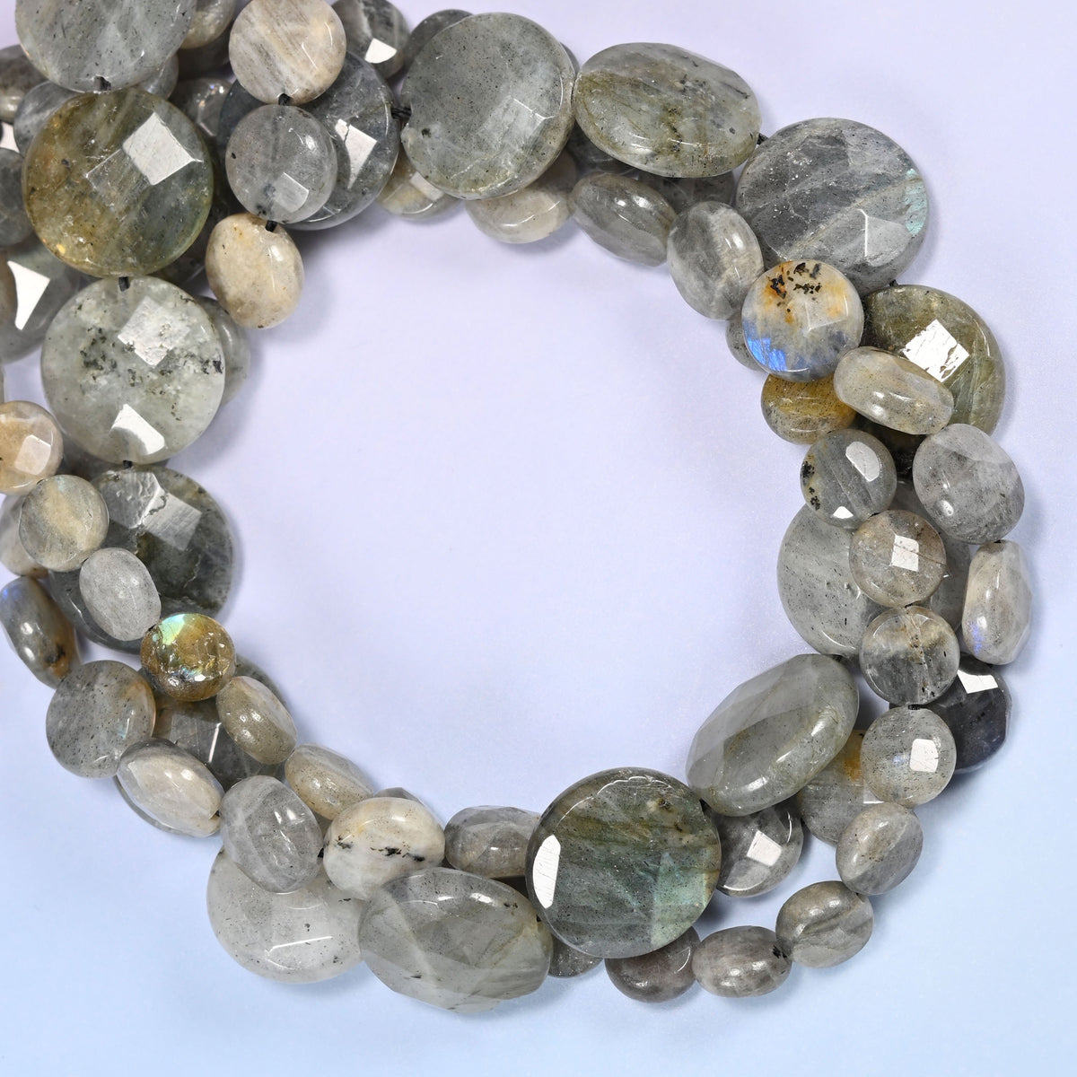 Gray Labradorite faceted coin beads coiled tight, cream and silver discs with dark speckling on some