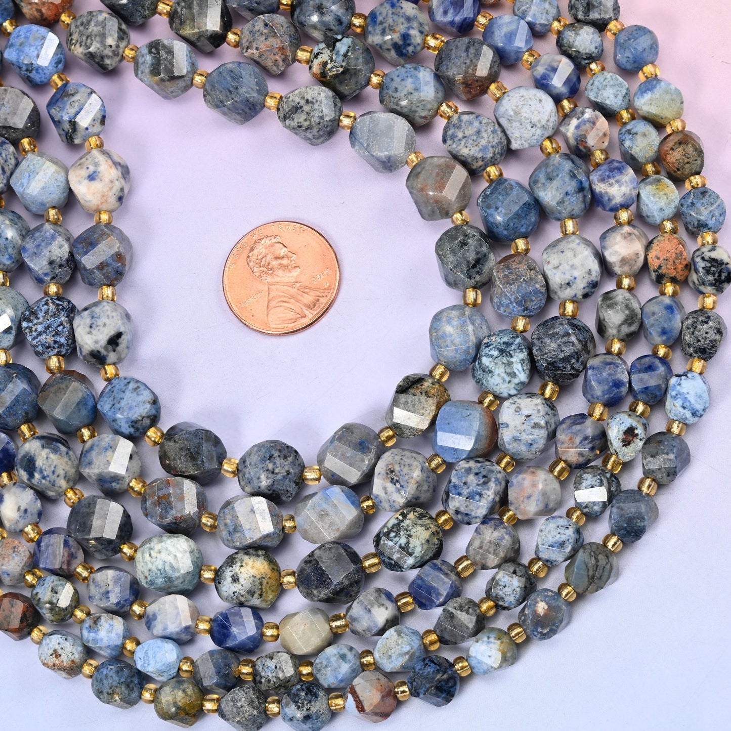 Sunset Dumortierite Faceted Spiral Twist Beads, dusty denim blue and pale grey speckled with inky navy and rust-brown patches