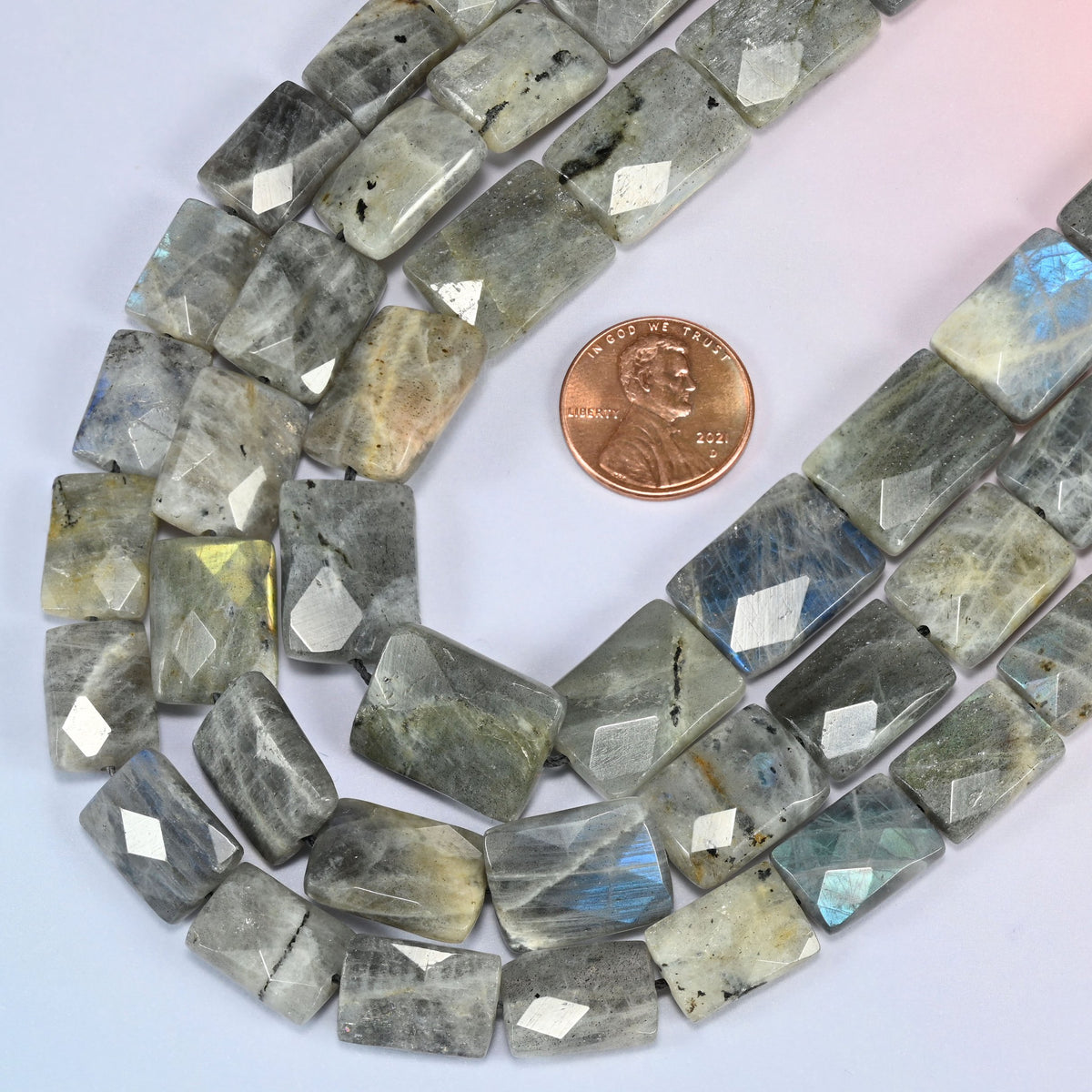 Gray Labradorite faceted flat rectangle beads in a deep loop, shown at their true size of 10x14mm to 13x18mm