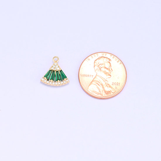 Small gold charms, one green fan charm shown beside a US penny for size