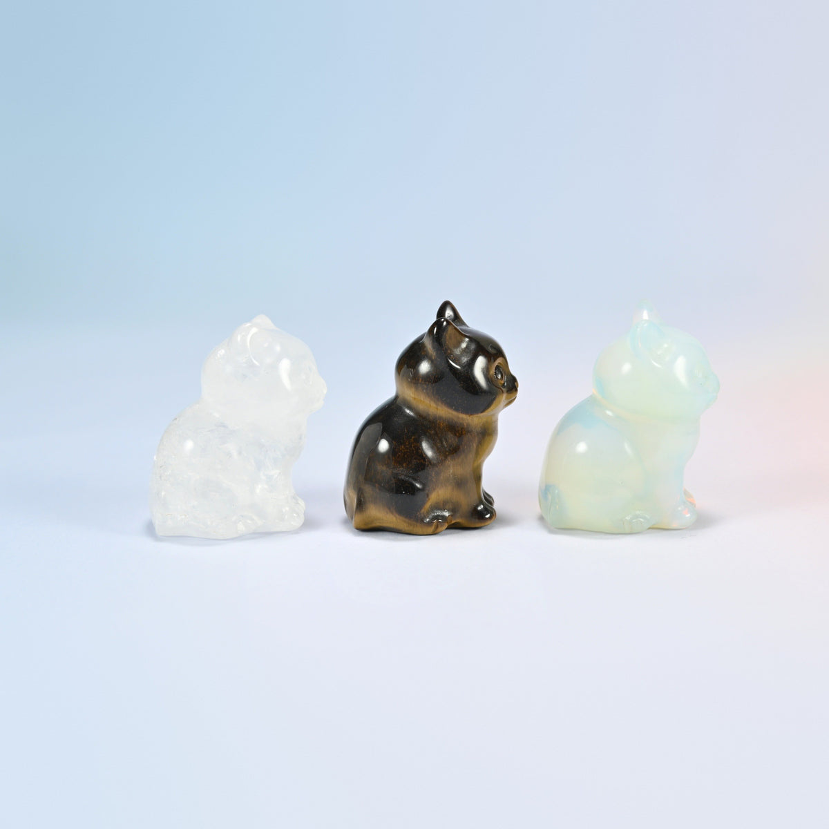 Clear quartz, tiger eye and opalite sitting cats with pointed ears