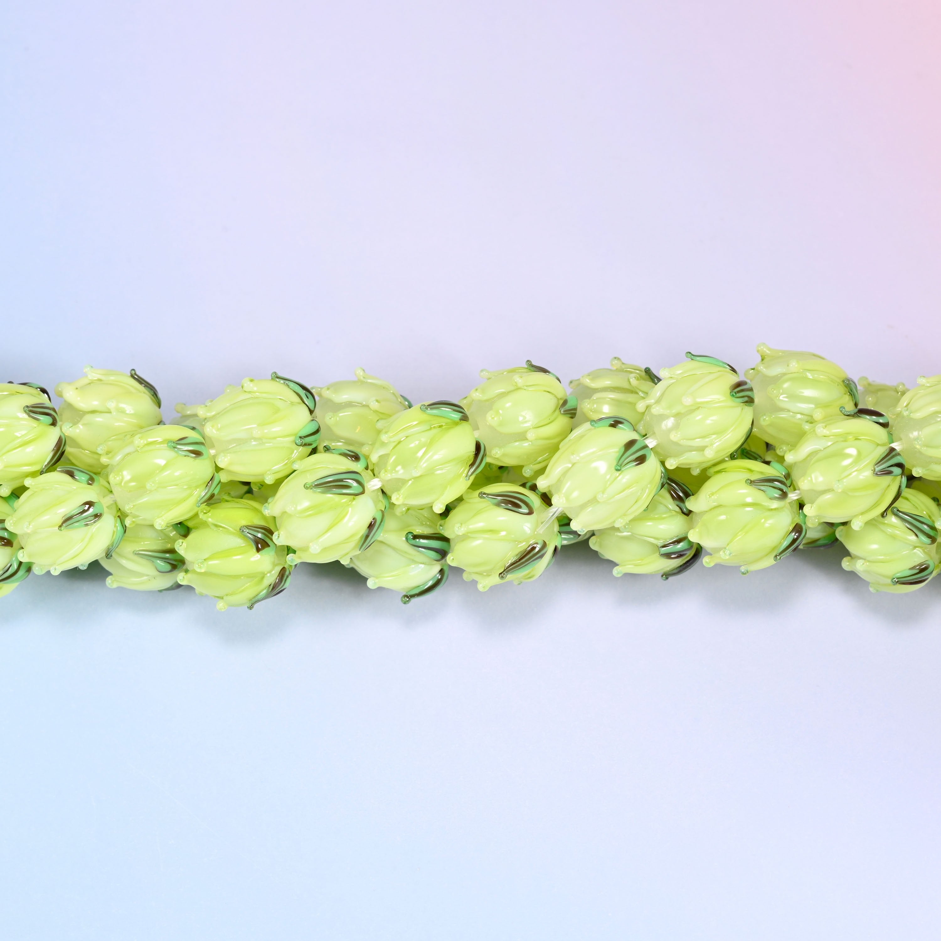 Lime green tulip flower bud lampwork glass beads, approximately 20 beads per strand
